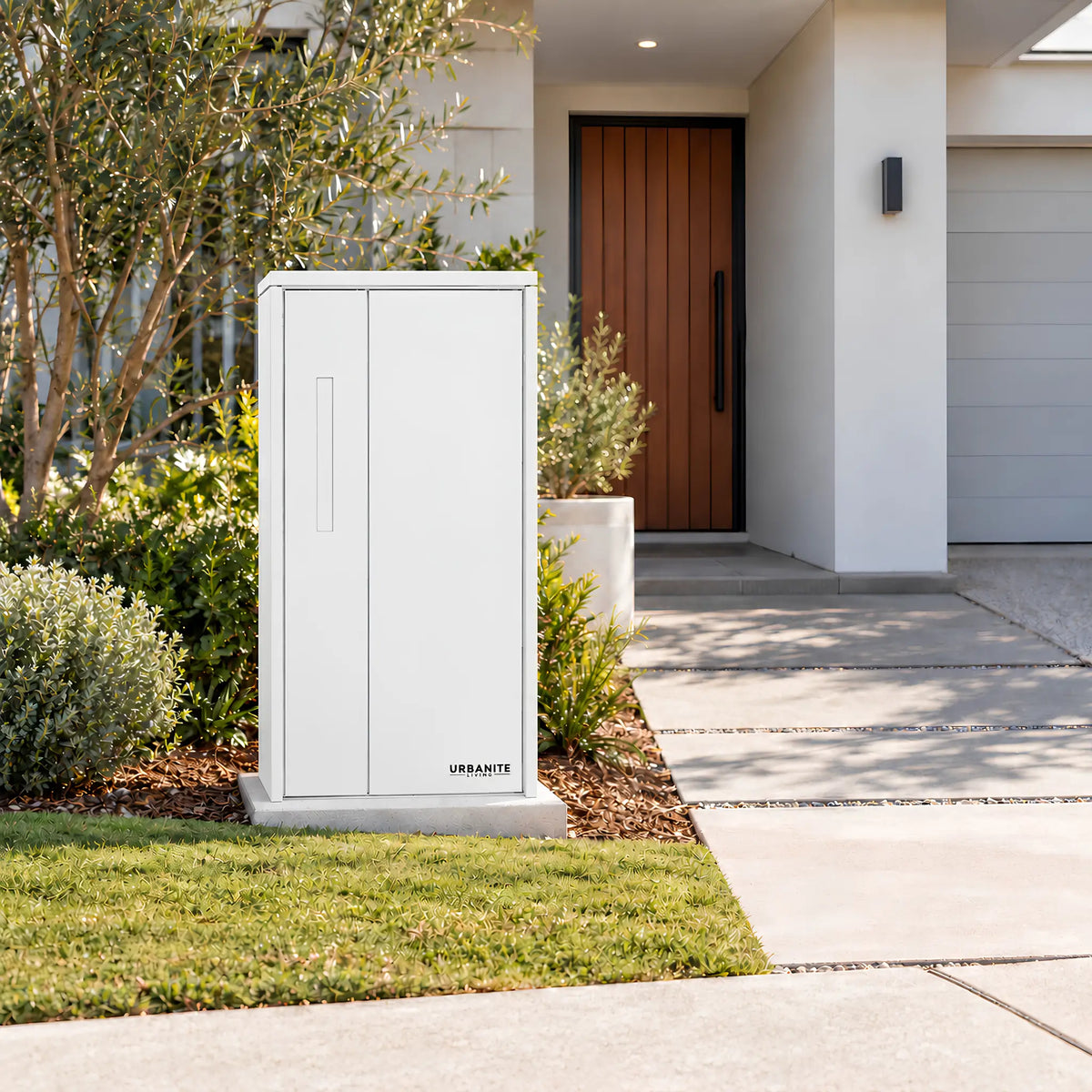 Urbanite Living The Don Extra Wide Parcel Letterbox in white beside a landscaped front path. 