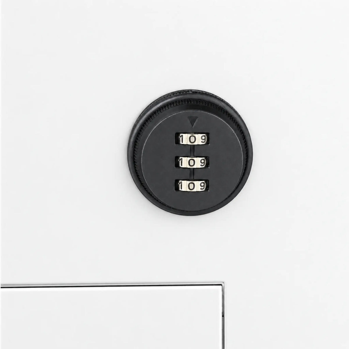 Close up of the combination lock on. the front of the white, Urbanite Living Finch Parcel Letterbox for installation into walls, brick, freestanding pillars and timber fences.