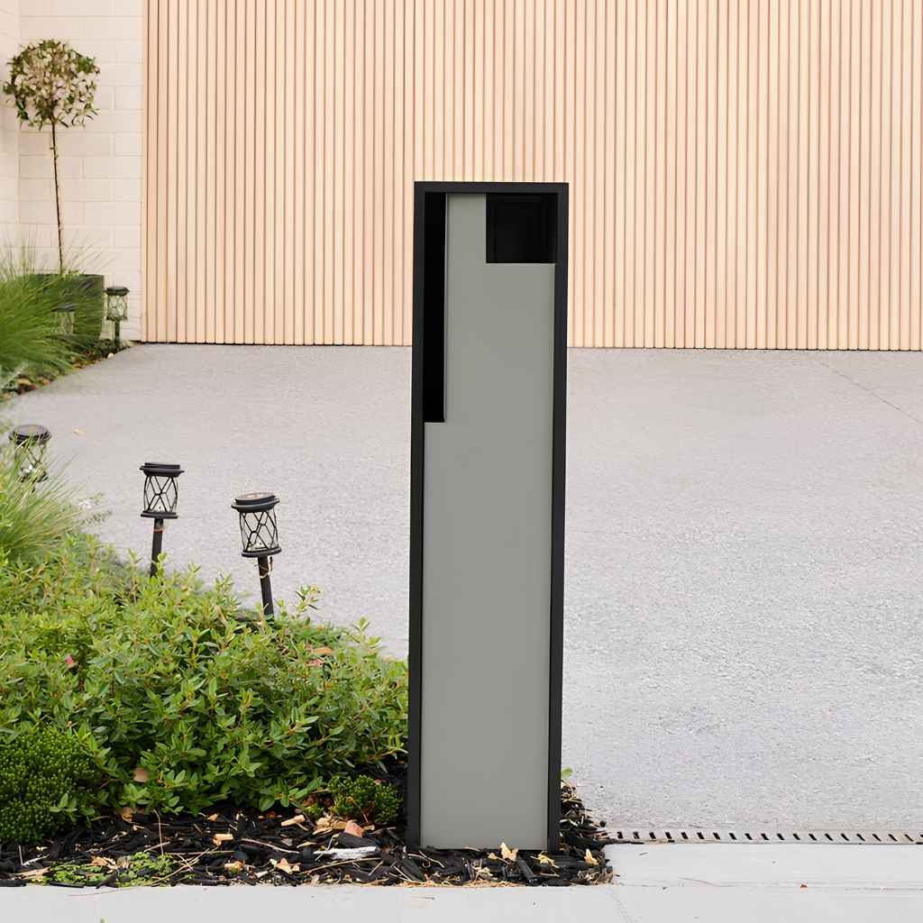 Swift Letterbox with a timber panel garage door in the background