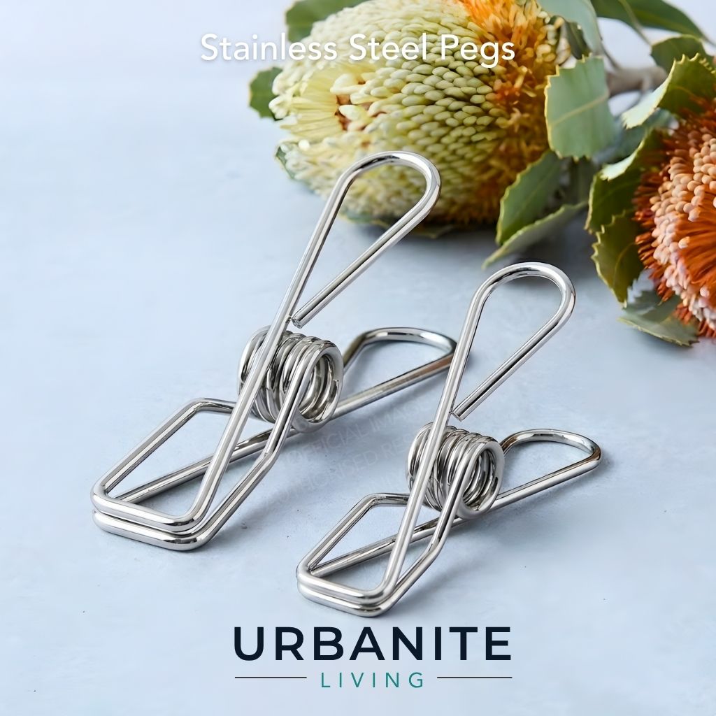 Urbanite Living 316 marine grade stainless steel pegs with two banksia flowers in the background.