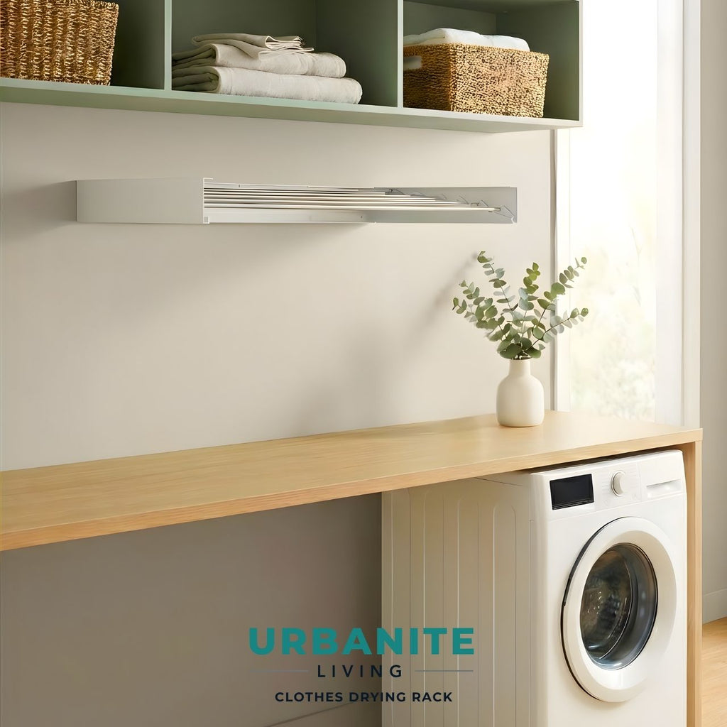 Urbanite Living wall mounted clothes drying rack folded completely flat against wall in modern laundry room.